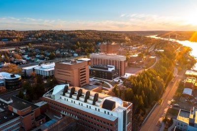 Aerial view of campus at sunset.