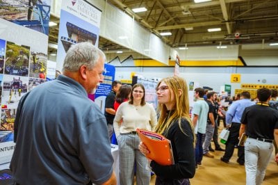 Student talking to a recruiter at Career Fair.