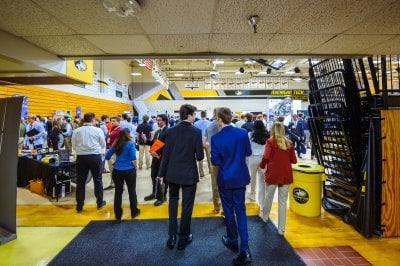 A look at the students and recruiters in the Wood Gym from the entrance.