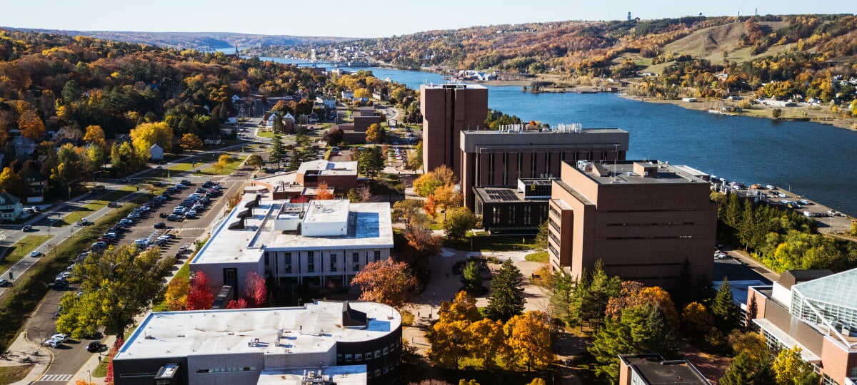 New studies show Michigan’s public universities generate nearly $45 billion in net new economic activity each year, including more than $972 million from Michigan Tech. Aerial view of Michigan Technological University’s campus in fall.
