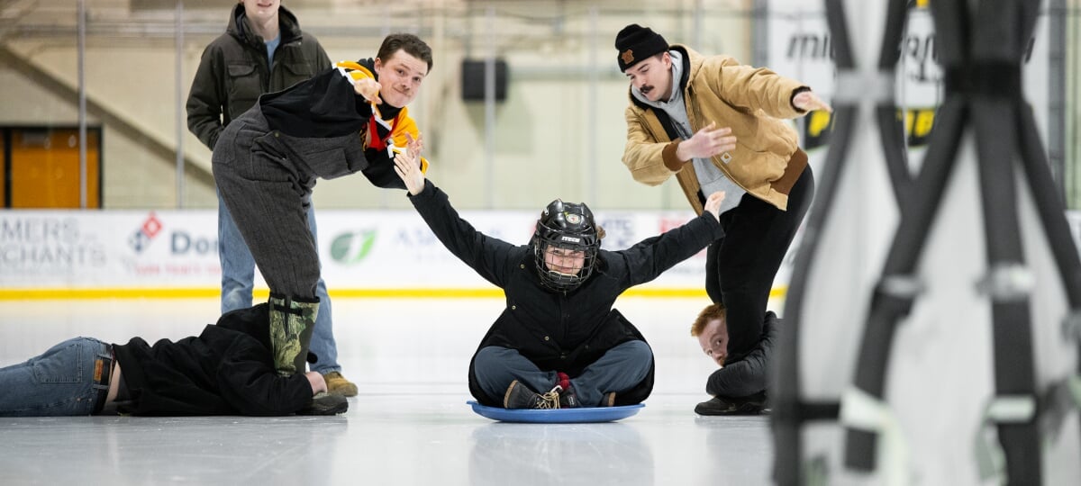 Human ice bowling is one of the many beloved Winter Games on the calendar for Winter Carnival 2026. A team of four people participate in the human ice bowling event at the Student Ice Arena.