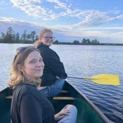 2 UB students in a canoe