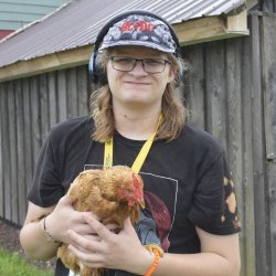 student holding a chicken