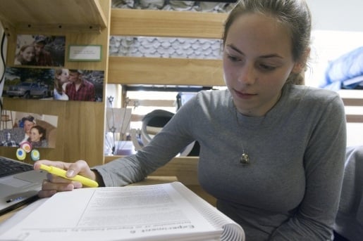 Student reading a text book.