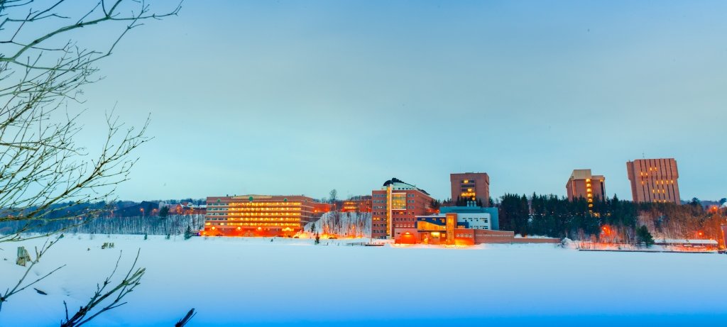 Michigan Tech campus across the frozen water at blue hour