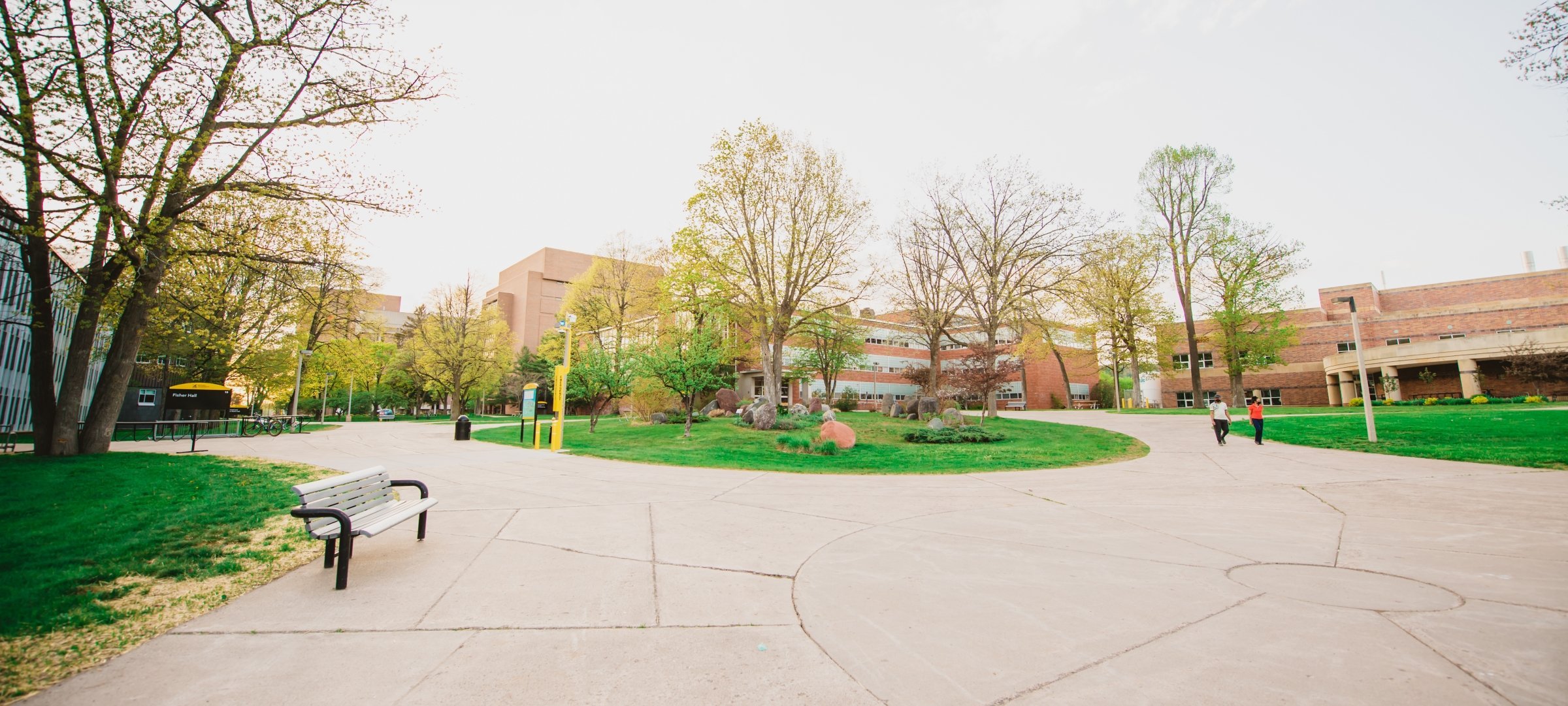 Spring break on campus with bench on the left side