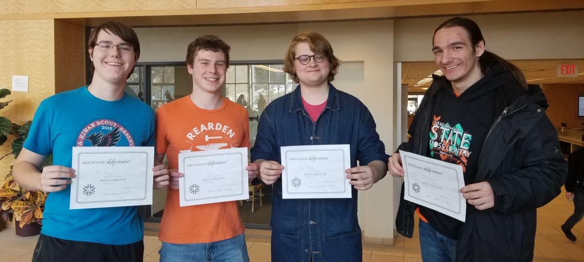 Students holding award