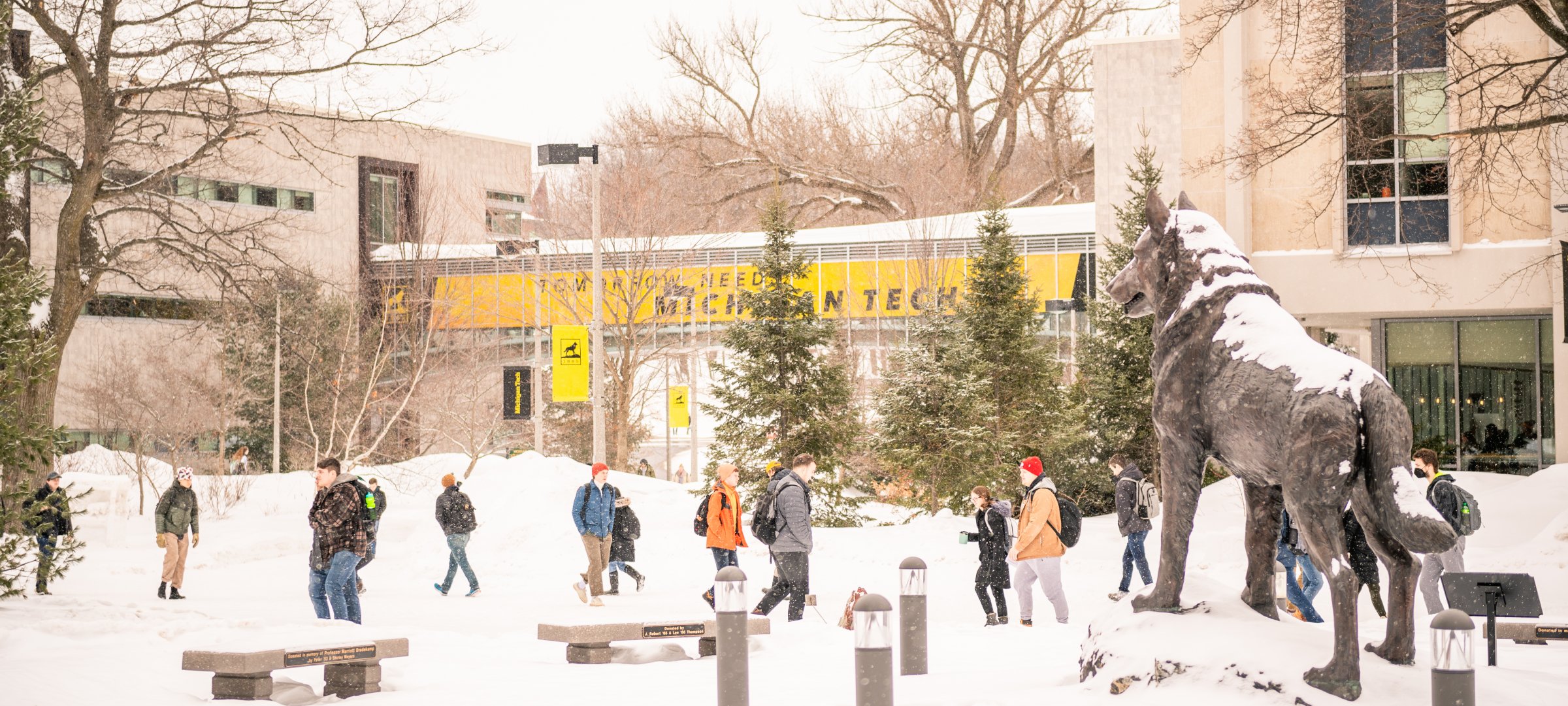 Image of campus mall with students walking and Blizzard statue