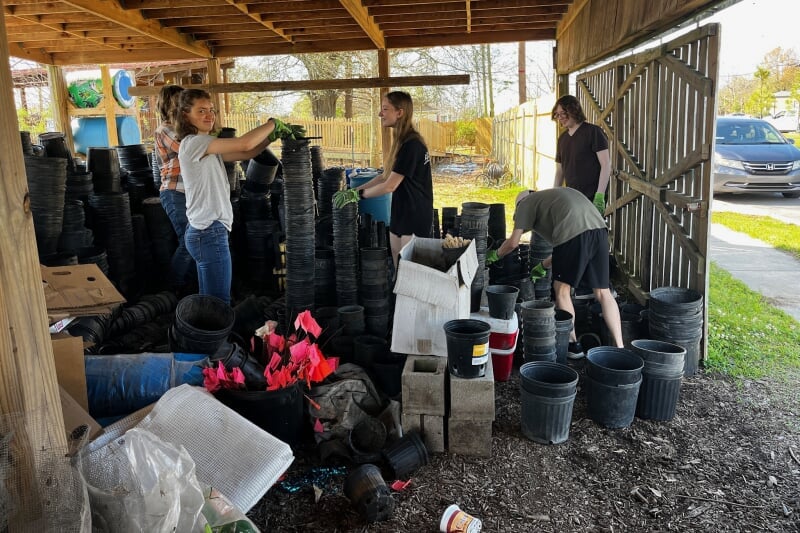 a group working with pots and dirts