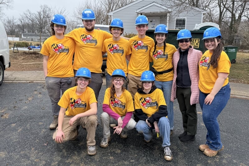 group posing in construction gear