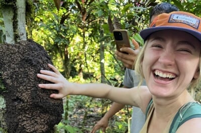 Olivia Luke '25 laughs as aunts crawl onto her hand off of a tree in the Ecuadorian rainforest.