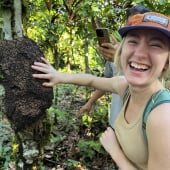 Olivia Luke '25 laughs as aunts crawl onto her hand off of a tree in the Ecuadorian rainforest.