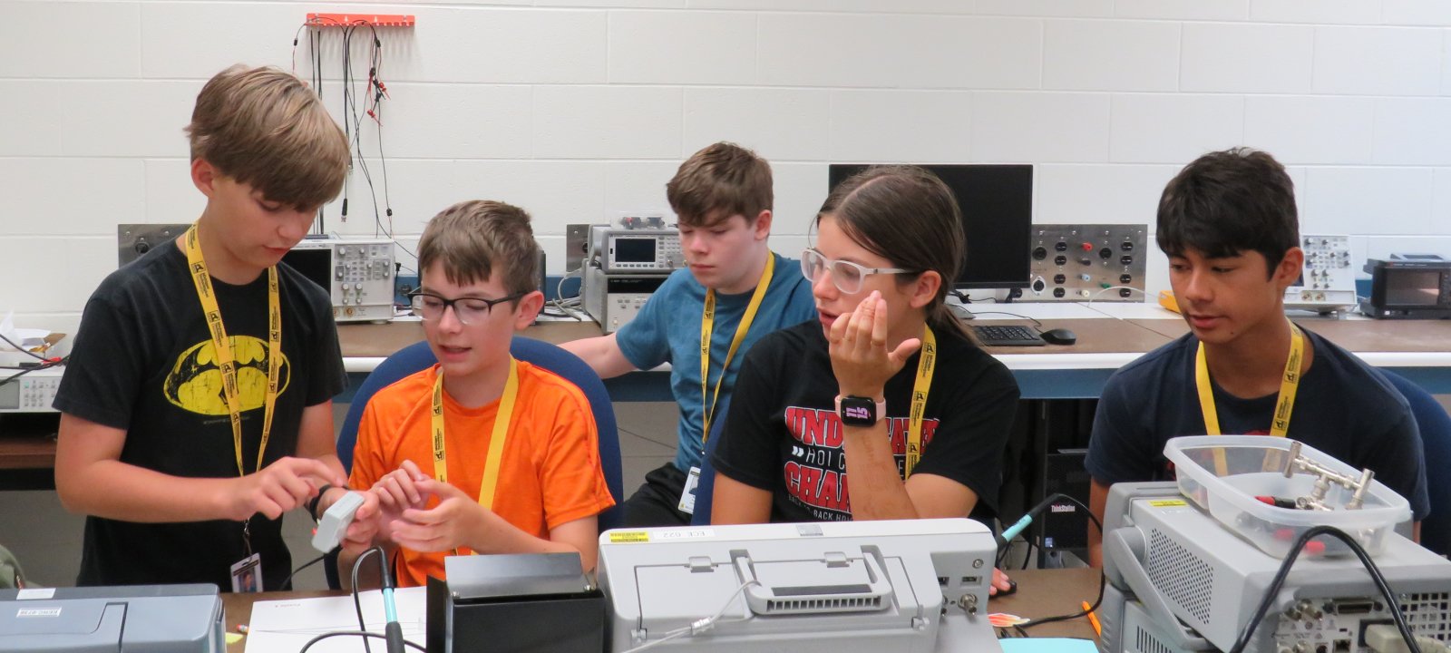 SYP robotics students in the lab