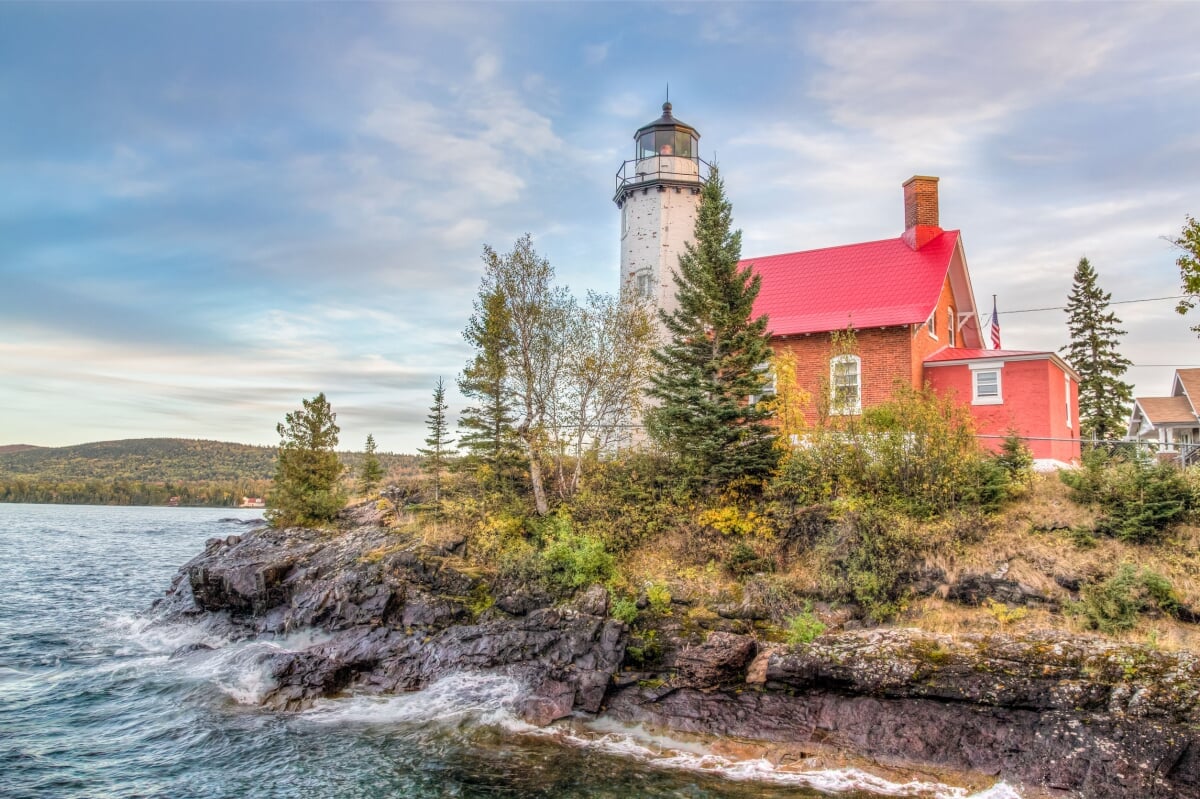 Eagle Harbor Lighthouse Lighthouse next to the water.