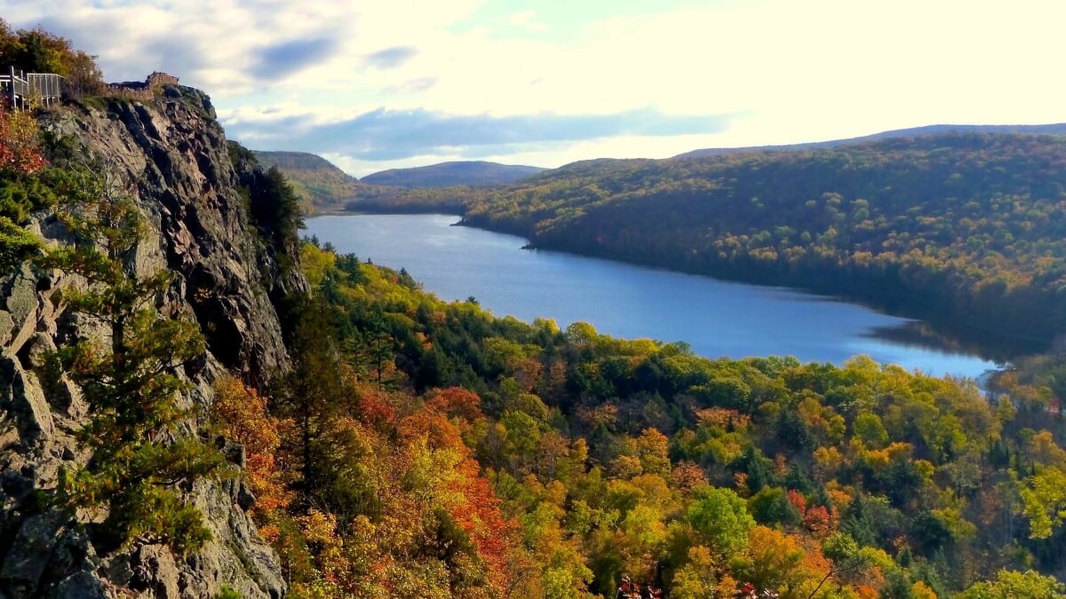 Porcupine Mountains Water running through a valley between mountains.