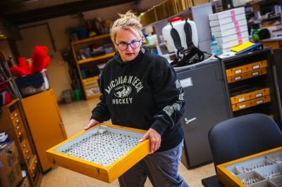 Tara Bal carrying a specimen case.