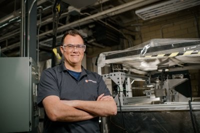 Paul van Susante poses in teh Planetary Surface Technology Development Lab.