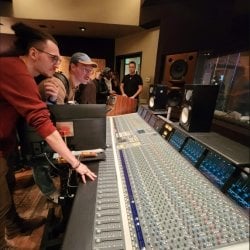 Students running a sound board.